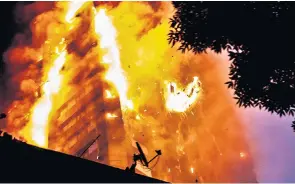  ??  ?? The extent of the inferno at Grenfell Tower can be seen, left, as burning debris falls into the streets and flames roar into the sky. People can be seen waving and screaming for help, right, as they are trapped in their apartments by the heat and smoke