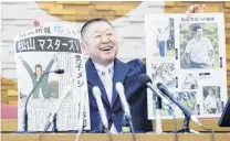  ?? PHOTO: REUTERS ?? Read all about it . . . Yasuhiko Abe, who coached Master champion Hideki Matsuyama during his Tohoku Fukushi University years, holds special editions of newspapers featuring Matsuyama’s Masters victory as he speaks at a press conference in Sendai, Japan, yesterday.