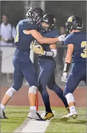  ?? Dan Watson/The Signal ?? West Ranch’s Jackson Reyes (10), center, celebrates after scoring a touchdown in the second quarter against Golden Valley on Friday.