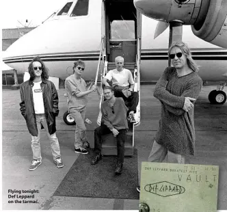  ??  ?? Flying tonight: Def Leppard on the tarmac.