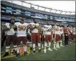  ?? STEVEN SENNE — THE ASSOCIATED PRESS ?? Washington Redskins players stand for the national anthem before a preseason NFL football game against the New England Patriots, Thursday in Foxborough, Mass.