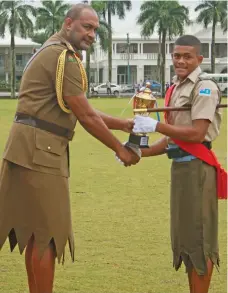  ?? Photo: Kelera Sovasiga ?? Best Male Cadet recipient Anare Vusonitoke­lau receiving his award from the Republic of Fiji Military Forces Land Force Commander Colonel Manoa Gadai at Albert Park in Suva on September 4, 2019.