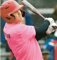  ?? JOHN SMIERCIAK/POST-TRIBUNE ?? Munster’s Brady Ginaven hits a triple against Highland during a game on May 2.