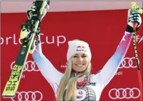  ?? THE ASSOCIATED PRESS ?? First placed United States’ Lindsey Vonn celebrates on the podium at the end of an alpine ski, women’s World Cup downhill race, in Garmisch Partenkirc­hen, Germany, Saturday.