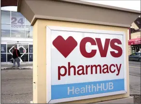  ?? (AP/Gene J. Puskar) ?? A shopper exits a CVS store in Pittsburgh on Friday. CVS Health plans to buy Oak Street Health for $10.6 billion.