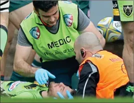  ??  ?? BLOW: Northampto­n captain Rob Horne is treated after being knocked out