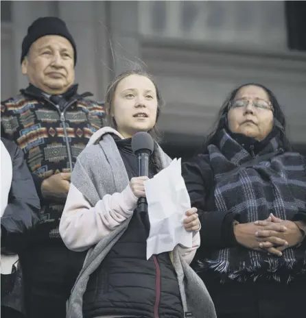  ?? PICTURE: MELISSA RENWICK/CANADIAN PRESS/AP ?? 0 Climate activist Greta Thunberg addresses a rally in Vancouver, Canada