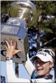  ?? AP file photo ?? Nelly Korda hoists the trophy after winning the Women’s PGA Championsh­ip last June. This year’s tournament starts Thursday.