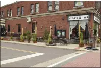  ?? RACHEL RAVINA — MEDIANEWS GROUP ?? Outdoor seating surrounds the entrance to Stove & Tap. The eatery is located at 329W. Main St. in Lansdale.