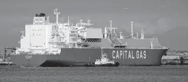  ?? Gareth Fuller/Associated Press ?? The liquefied natural gas ship Attalos arrives at the Isle of Grain terminal, east of London, on Aug. 24 after traveling from Australia carrying a cargo that originated at the North West Shelf project.