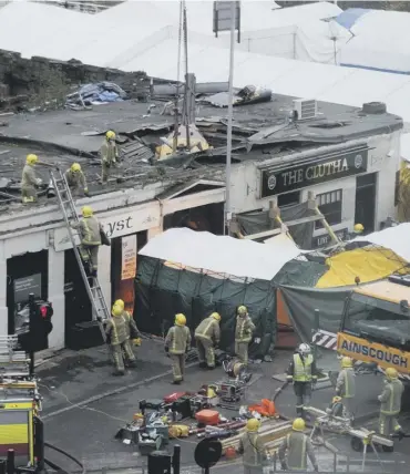  ?? PICTURE; PA ?? 0 Firefighte­rs on the scene after the Clutha disaster