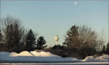  ?? JENN ACKERMAN — THE NEW YORK TIMES ?? A water tower in Lac du Flambeau, Wis., is seen earlier this month. Leaders of the Lac du Flambeau Band of Lake Superior Chippewa blocked four residentia­l streets that cross their property, demanding long overdue payment for roads used by non-Native residents, who are now unable to drive home.