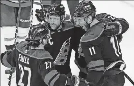  ?? [GERRY BROOME/THE ASSOCIATED PRESS] ?? Hurricanes' Jordan Staal (11), Justin Faulk (27) and Justin Williams (14) celebrate Staal's goal against the Capitals during the third period of Game 6 of an NHL first-round playoff series Monday in Raleigh, N.C.