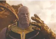  ?? FILM FRAME/MARVEL STUDIOS ?? Thanos (Josh Brolin) holds up the Infinity Gauntlet, which is powered by the Infinity Stones and has places prepared for each.