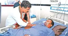  ?? PTI ?? Chhattisga­rh Deputy CM Vijay Sharma visits a security man injured in the Kanker gunfight.