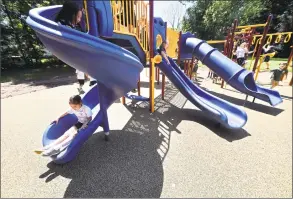  ?? Arnold Gold / Hearst Connecticu­t Media ?? St. Rita School kindergart­ners try out their new playground after a ribbon-cutting ceremony Monday in Hamden.