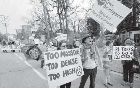  ?? ADRIAN LAM, TIMES COLONIST ?? Catherine Ellis, left, and Bindon Kinghorn are among protesters in front of the Abstract Developmen­ts site on Rockland’s edge.