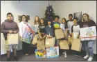  ?? BEA AHBECK/ NEWS-SENTINEL ?? Students from Joe Serna Junior Charter School donated toys to the Lodi Adopt-AChild center in Lodi on Friday.