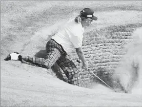  ?? Lyn Kirk/getty Images ?? Second-round leader Miguel Angel Jimenez ballooned to a 77 Saturday at Muirfield because of lies such as this in a bunker on the fourth hole.
