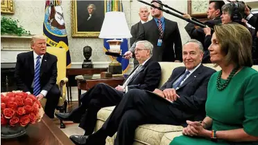  ??  ?? Getting things done: Trump meeting (second from left) McConnell, Schumer, Pelosi and other congressio­nal leaders in the Oval Office. — Reuters