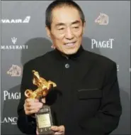  ?? BILLY DAI — THE ASSOCIATED PRESS ?? Chinese director Zhang Yimou holds his award for Best Director at the 55th Golden Horse Awards in Taipei, Taiwan, Saturday.