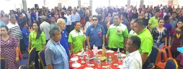  ??  ?? Rayong (front table, fourth left) joins others in singing the national anthem.