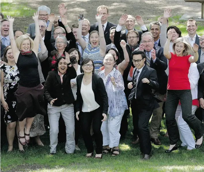  ?? Larry Wong/Edmonton Journal ?? Premier Rachel Notley, left, and her caucus break out in dance after a group photo outside the Legislatur­e on Thursday as the NDP government wrapped up its first legislativ­e session.