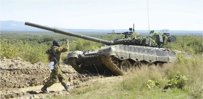  ?? Yu Tamura/The Yomiuri Shimbun ?? A Russian tank is deployed at the Uspenovsky training ground in the Russian Far East on Sakhalin on Sunday.