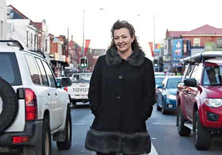  ??  ?? Above: Shebah founder George McEncroe in Elizabeth St, North Hobart. McEncroe is also a stand-up comedian but finds nothing funny about women passengers and drivers feeling vulnerable while going about their daily lives.