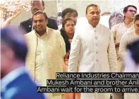  ??  ?? Reliance Industries Chairman Mukesh Ambani and brother Anil Ambani wait for the groom to arrive.