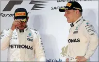  ??  ?? Moving on: Lewis Hamilton (far left) did get the better of Valtteri Bottas in Bahrain but his team-mate can put in a strong show in Russia