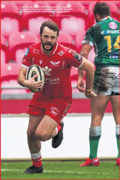  ?? Picture: Huw Evans Agency. ?? Paul Asquith evades Benetton right wing Angelo Esposito on his way to scoring a try for the Scarlets last Saturday. Match report in our 8-page pullout.
