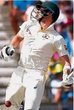  ??  ?? Superb form: Australia’s captain Steve Smith reacting after being hit on the hand during the second day of the third Ashes Test match yesterday. — Reuters