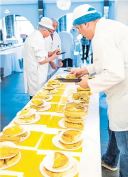  ?? Pictures: Steven Brown. ?? Food samples being poked, prodded and tasted and top right: two sets of expert eyes assess the wares.