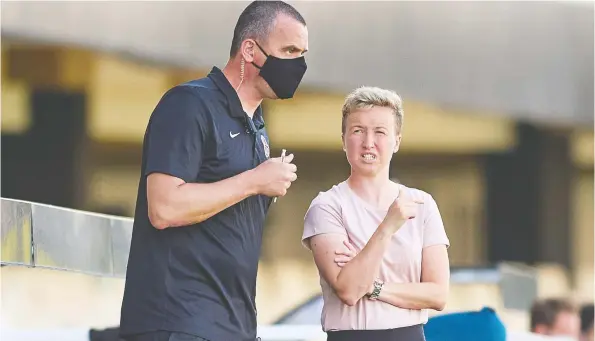  ?? GERARD FRANCO / CANADA SOCCER FILES ?? Bev Priestman speaks to assistant Michael Norris during a game in Spain on June 11. Priestman says the team is capable of going for the gold.