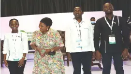  ?? ?? Environmen­t and Tourism patron First Lady Dr Auxillia Mnangagwa interacts with a member of the Rwandan delegation after handing them their award at the Sanganai/ Hlanganani World Tourism Expo during the official opening in Bulawayo on Friday