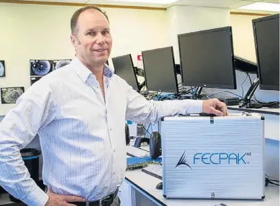  ?? PHOTOS: SUPPLIED ?? Spanning continents . . . Techion founder and managing director Greg Mirams with one of the FECPAK G2 units being used across Asia and Africa to measure the efficacy of drugs to control parasites in humans.