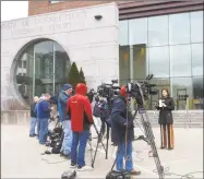  ?? Tyler Sizemore / Hearst Connecticu­t Media ?? News crews report on the condition of Fotis Dulos outside state Superior Court in Stamford on Tuesday. Dulos was scheduled to appear in court for an emergency bond hearing on Tuesday when police found him unresponsi­ve at his home in Farmington. Fotis Dulos is charged with murdering his estranged wife, Jennifer Farber Dulos.