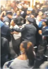  ??  ?? In a video from Thursday, March 1, nearly 100 students crowd the halls of Murry Bergtraum and clash with police. The school, the most overcrowde­d in the city, has