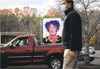  ?? SPENCER PLATT GETTY IMAGES ?? A sign showing voting rights activist Stacey Abrams is displayed at a rally Sunday in Lilburn, Ga., for Democratic candidate Jon Ossoff, who is running in a runoff election against Sen. David Perdue, R-Ga.