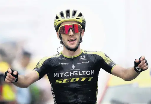  ?? Christophe Ena ?? ●●Britain’s Simon Yates celebrates as he crosses the finish line to win the fifteenth stage of the Tour de France cycling race over 185 kilometers in July this year