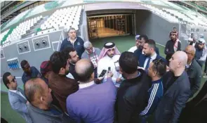  ??  ?? SC’s Education City Stadium Project Manager Eid al-Qahtani (centre) speaks to the media during a tour of the Education City Stadium (above).