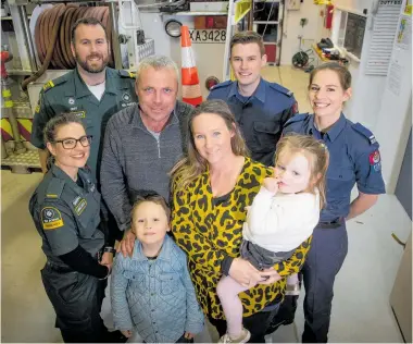  ?? Photo / Dean Purcell ?? Young Ivy Barn with her parents Laura and John, older brother Kieran and first responders Brienna Forster and Jeff Mabbett, from St John, and Arie Litherland and Lauren Malkin, from Fire &amp; Emergency.