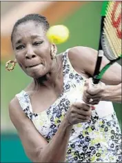  ?? Photograph­s by John G. Mabanglo EPA/Shuttersto­ck ?? VENUS WILLIAMS, shown playing sister Serena on Monday, beat Anastasija Sevastova on Tuesday.