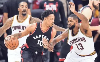  ?? KEN BLAZE, USA TODAY SPORTS ?? DeMar DeRozan, above, driving against Tristan Thompson, and fellow Raptors guard Kyle Lowry felt pressure all night from the Cavaliers in Game 1 of the teams’ playoff series.