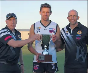  ??  ?? TRIUMPHANT: From left, Wimmera Football League chief commission­er Trevor Albrecht, interleagu­e captain Luke Chamberlai­n and interleagu­e coach Guy Smith celebrate a win.