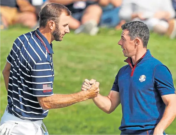  ?? Picture: Shuttersto­ck. ?? Dustin Johnson and Rory McIlroy met in competitio­n at the last Ryder Cup in Paris with plenty of fans in attendance.