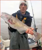  ??  ?? ■ Gez Locke, of Bridgend, caught this 7lb cod on lugworms on a running leger rig while fishing off Porthcawl on his dad’s private boat.