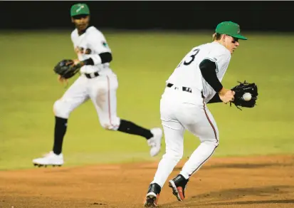  ?? BILLY SCHUERMAN/THE VIRGINIAN-PILOT PHOTOS ?? Coby Mayo, fielding a ball from third base during a game for the Triple-A Norfolk Tides on March 29, is making a case to be the Orioles’ next top prospect promoted to the big leagues.