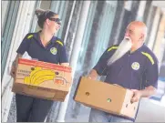  ?? PHOTO/ BEN FRASER ?? Ashleigh Stokes and Rex Meihana from Kids.com. Educarecen­tral deliver food to the Rotorua Daily Post Christmas Appeal.